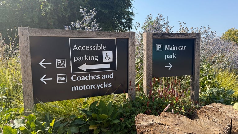 Signposts pointing to the car park at Polesden Lacey